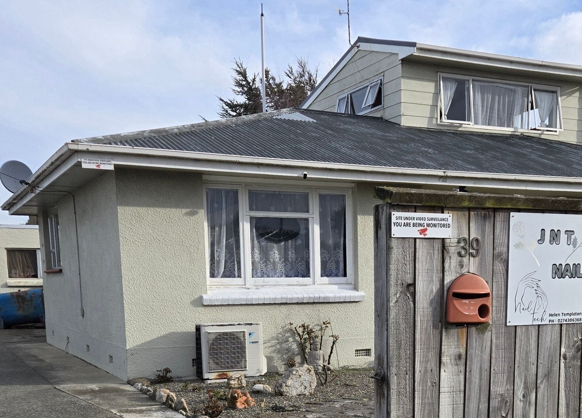 Exterior view of JNT Nails in Invercargill, Southland, NZ welcoming guests with modern design.
