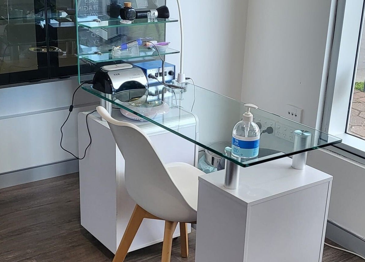 Modern glass-top beauty station at ABOUT FACE Beauty & Anti Aging Salon, Greenway, Australian Capital Territory, AU.