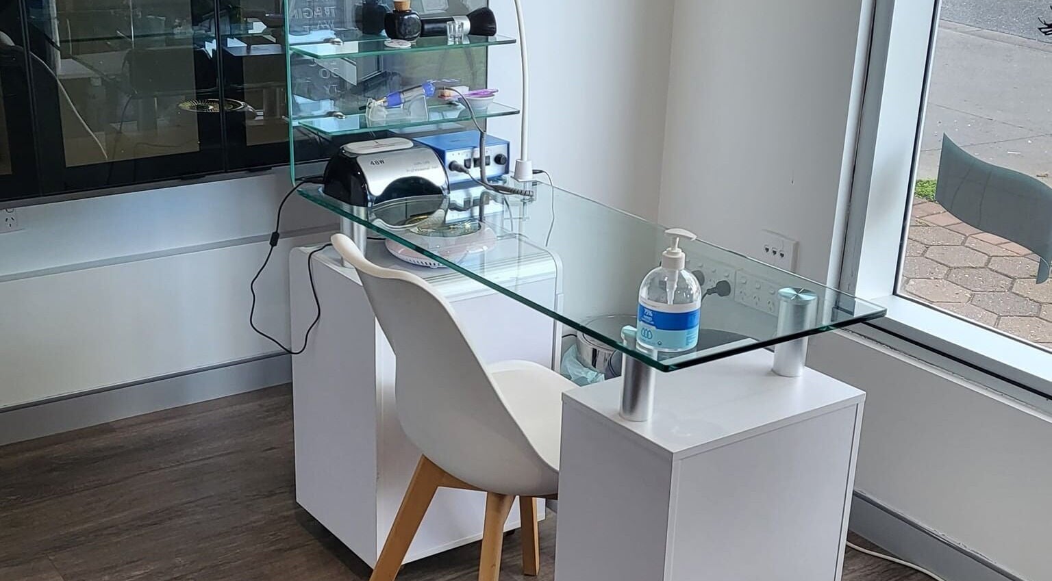Modern glass-top beauty station at ABOUT FACE Beauty & Anti Aging Salon, Greenway, Australian Capital Territory, AU.