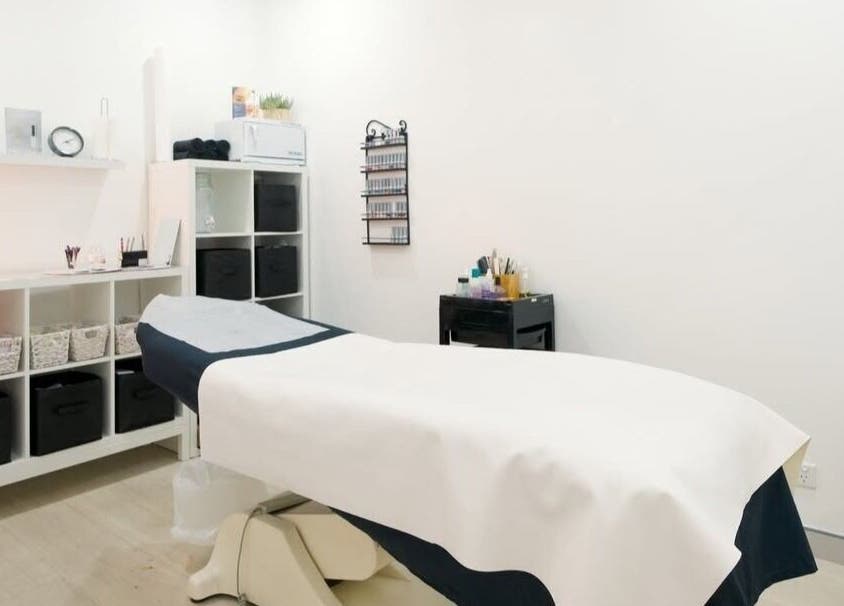 Calm treatment room at ABOUT FACE Beauty & Anti Aging Salon, Greenway, ACT, AU, showcasing a cozy and clean setting.