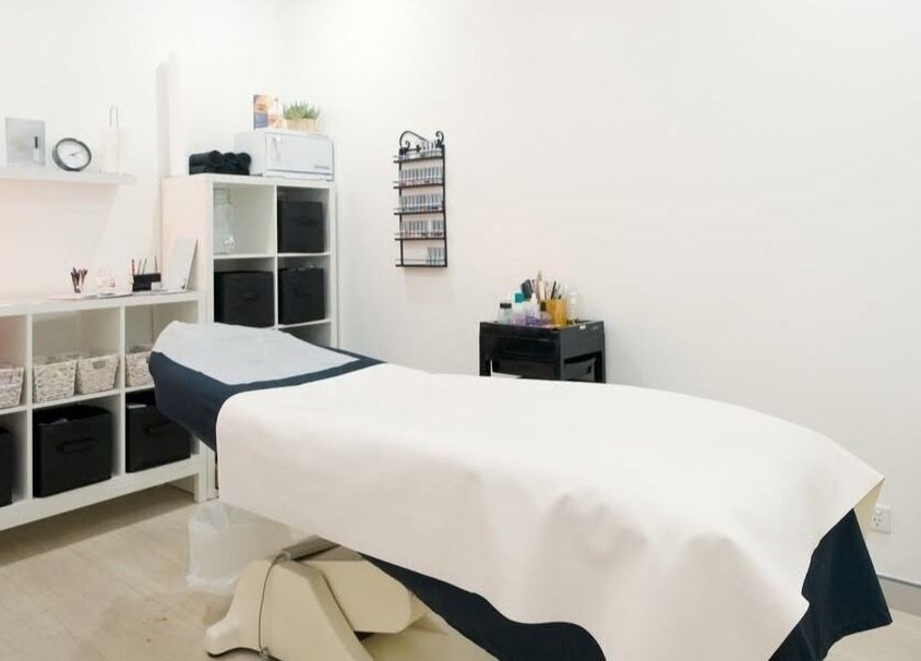 Calm treatment room at ABOUT FACE Beauty & Anti Aging Salon, Greenway, ACT, AU, showcasing a cozy and clean setting.