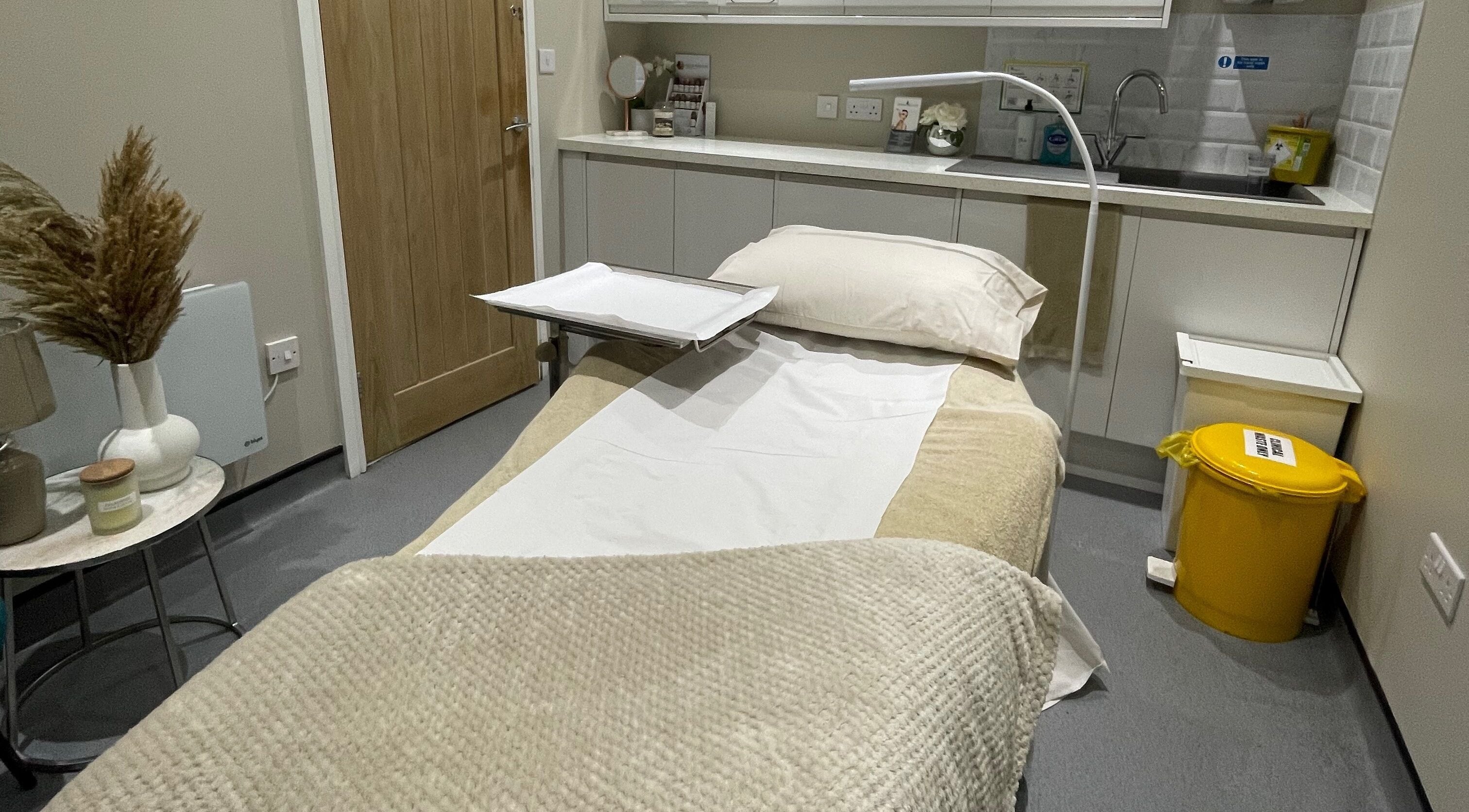 Relaxing therapy room at Bellissima, Chandler's Ford, England, GB, featuring a cozy treatment bed.