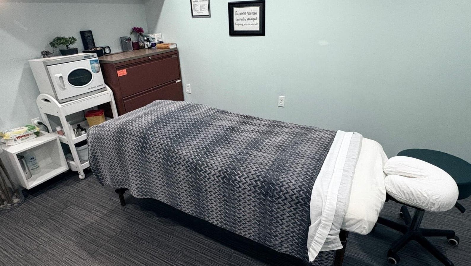 Cozy massage room with a treatment bed at Massage Therapy & Wellness Centre, Brampton, Ontario, CA.