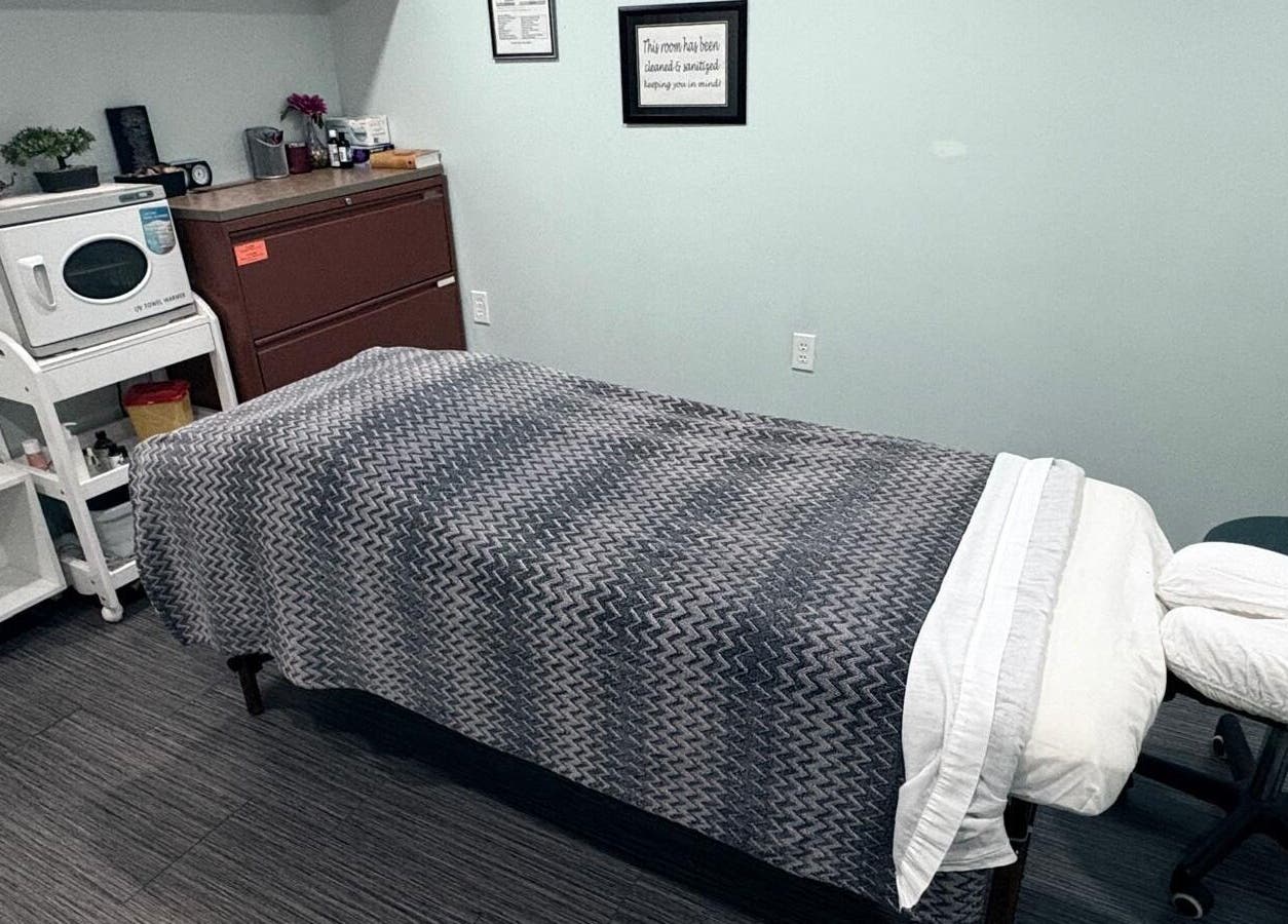 Cozy massage room with a treatment bed at Massage Therapy & Wellness Centre, Brampton, Ontario, CA.
