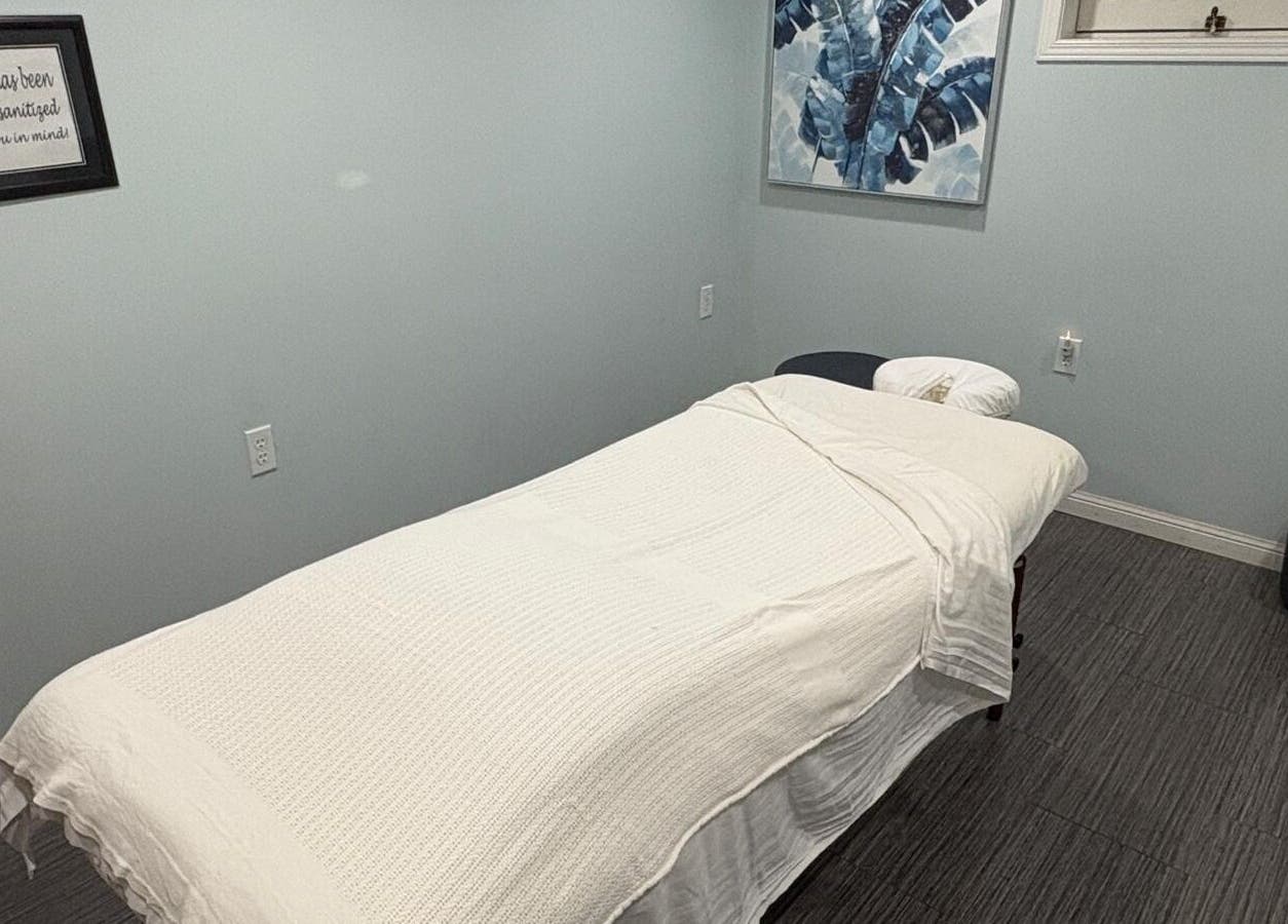 Peaceful massage room at Massage Therapy & Wellness Centre, Brampton, Ontario, CA, featuring a cozy massage table.