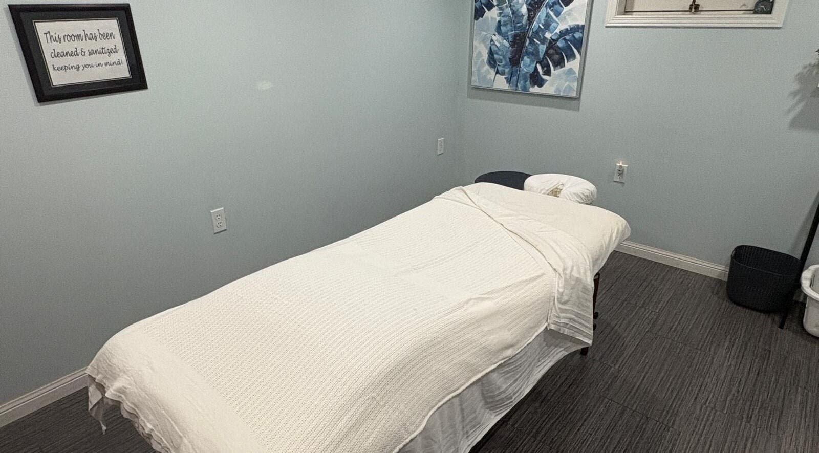 Peaceful massage room at Massage Therapy & Wellness Centre, Brampton, Ontario, CA, featuring a cozy massage table.