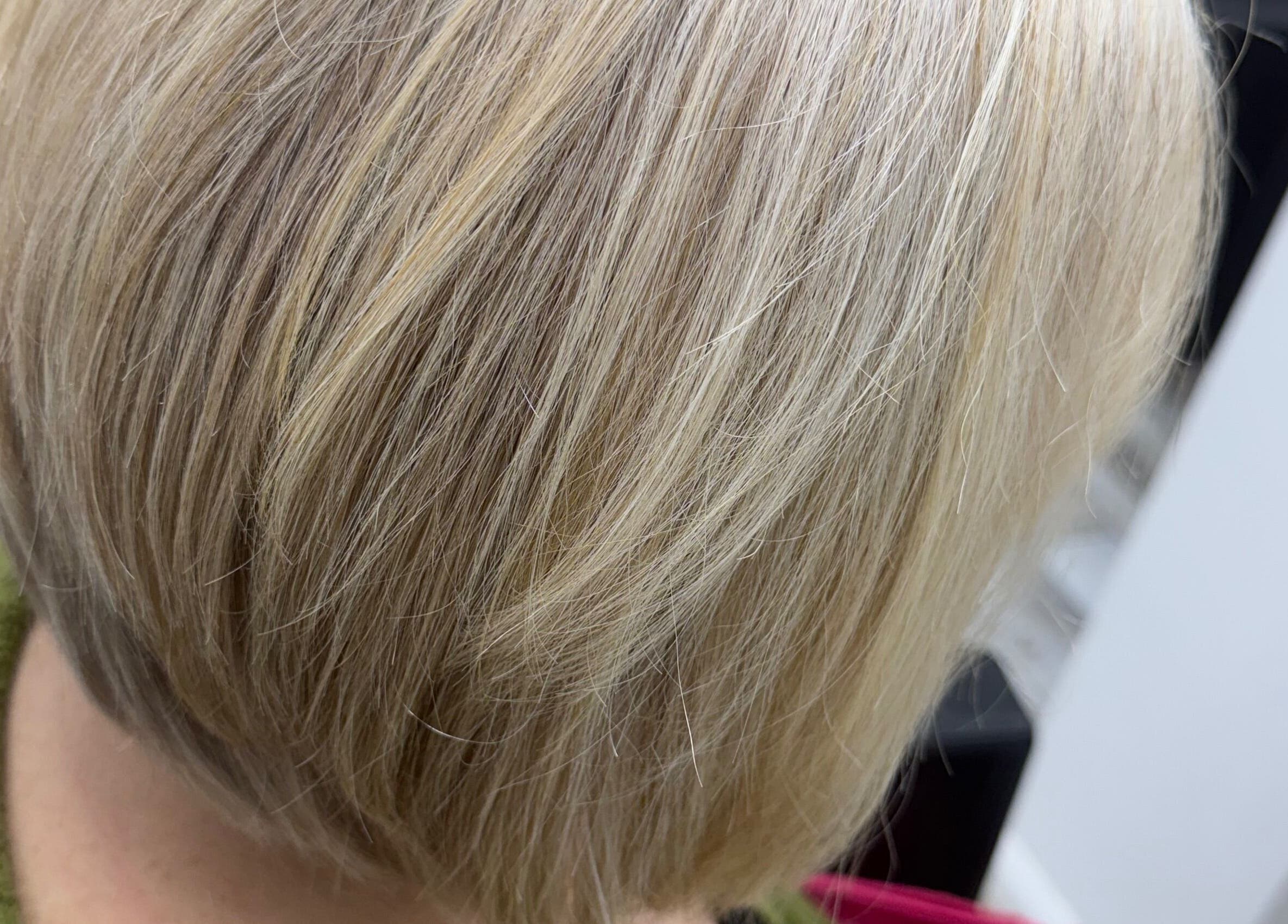 Elegant blonde bob haircut at Liv Bridal & Hair, Camborne, England, GB. Smooth, stylish finish.