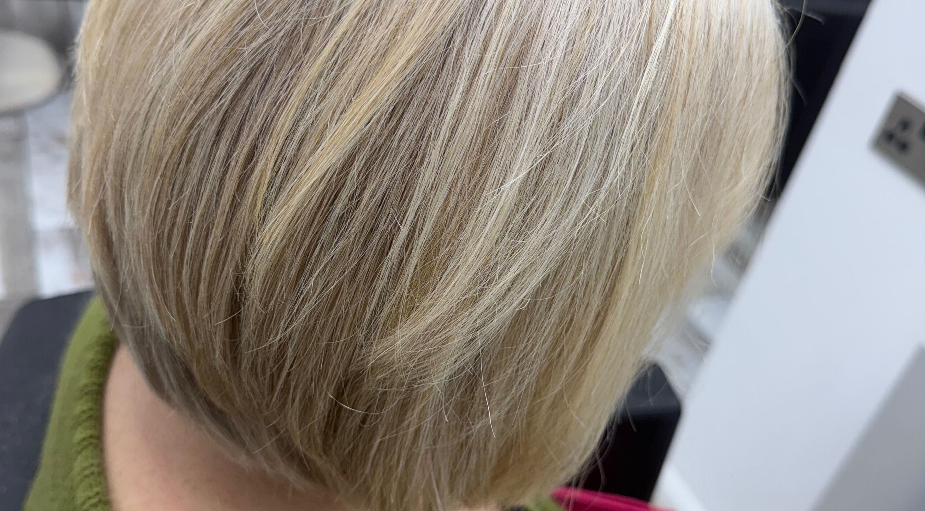 Elegant blonde bob haircut at Liv Bridal & Hair, Camborne, England, GB. Smooth, stylish finish.