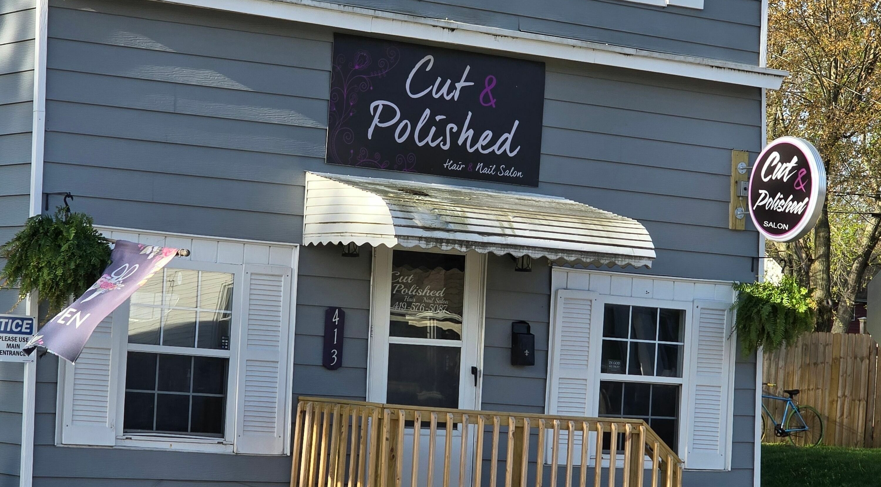 Front view of Cut and Polished Hair and Nail Salon in Defiance, Ohio, US showcasing entrance and signage.