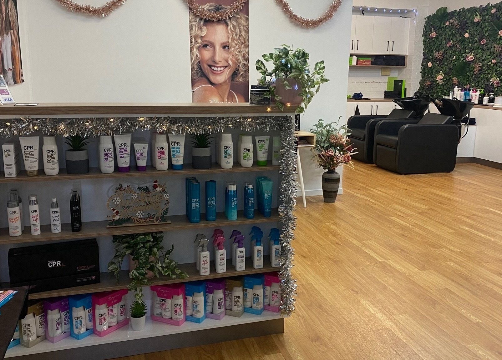 Chic interior of Caboolture Cuts & Curls in Caboolture, Queensland, AU showcasing product display and seating.