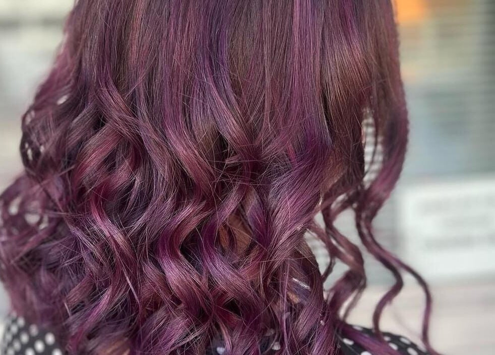 Vibrant purple curls styled at Caboolture Cuts & Curls in Caboolture, Queensland, AU.