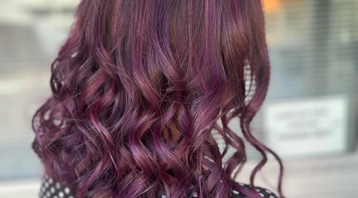 Vibrant purple curls styled at Caboolture Cuts & Curls in Caboolture, Queensland, AU.