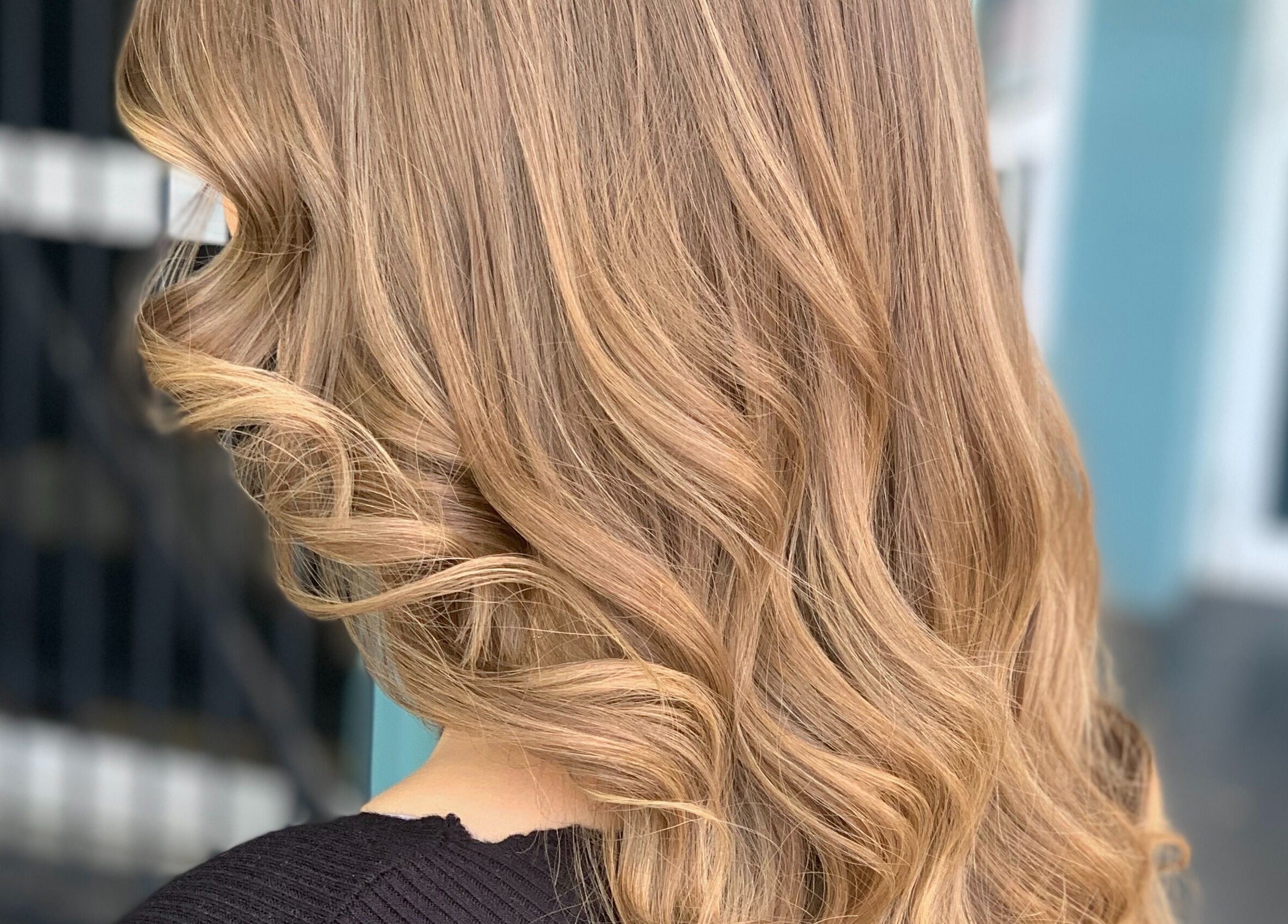 Blonde curled hairstyle at Caboolture cuts & curls, Caboolture, Queensland, AU.