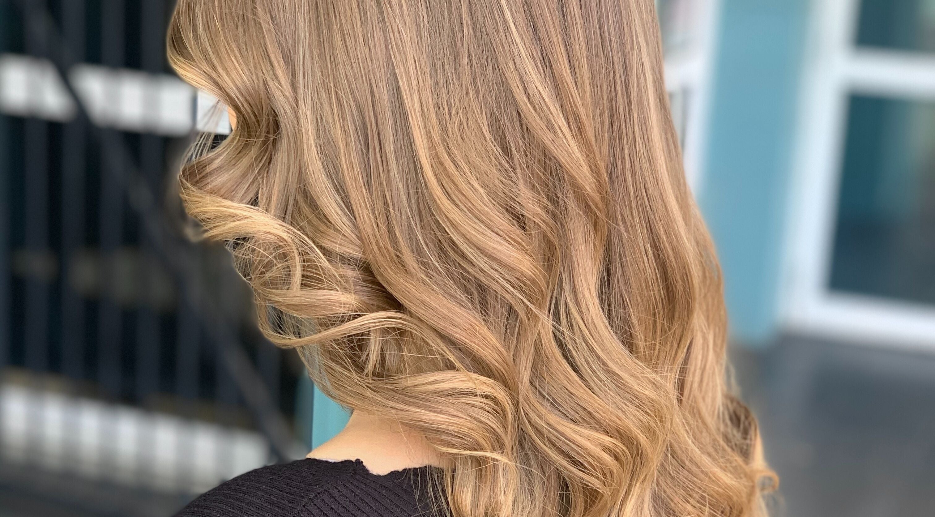 Blonde curled hairstyle at Caboolture cuts & curls, Caboolture, Queensland, AU.