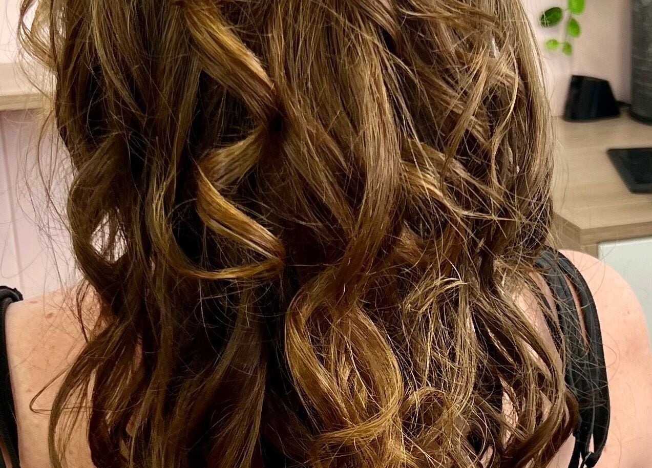 Curly hairstyle at Caboolture cuts & curls, Caboolture, Queensland, AU. Perfect for a chic look.