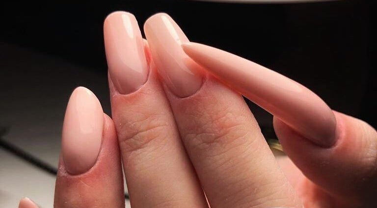 Close-up of manicured nails in a soft pink at Nailfix, Malahide, IE.