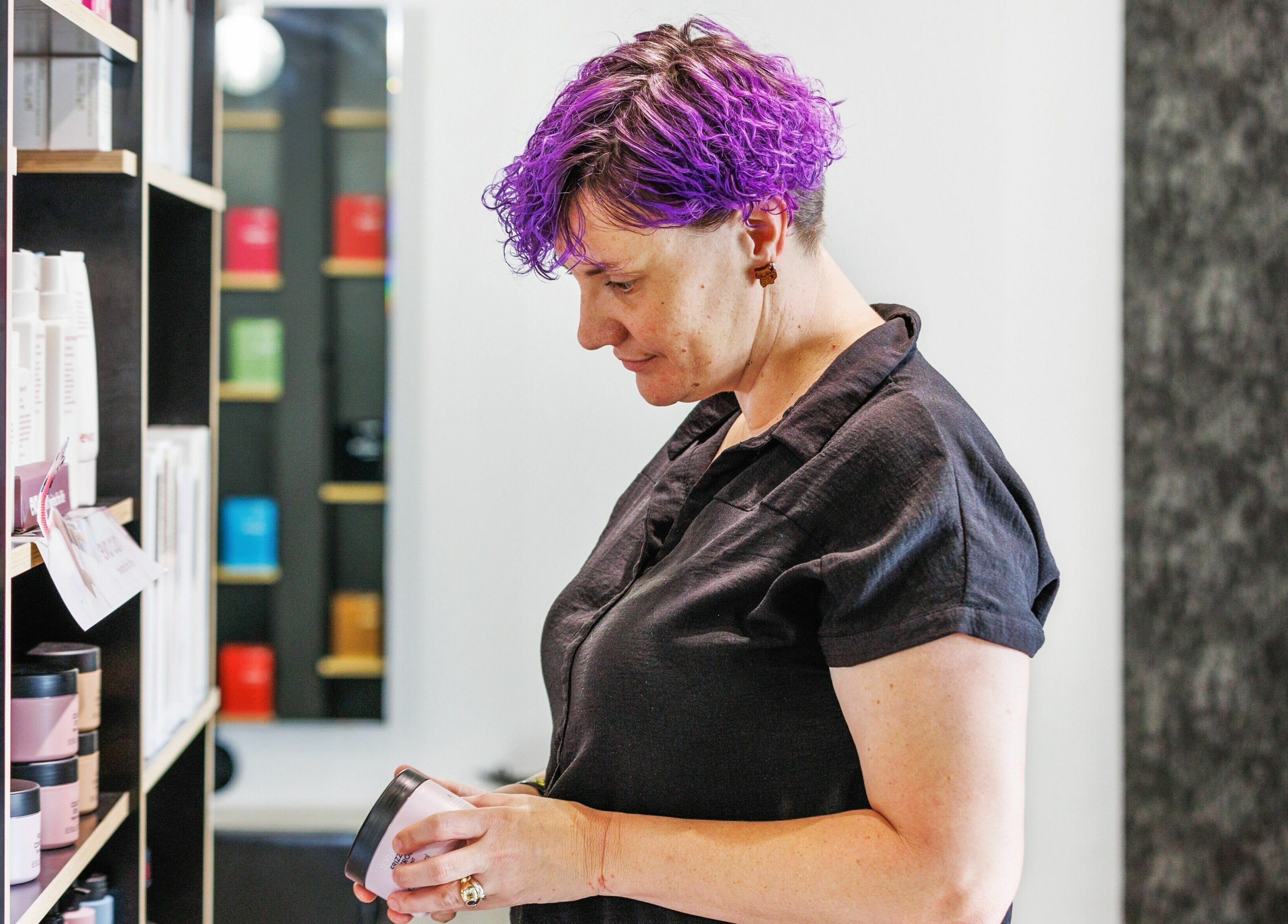 Customer explores beauty products at Lunatic Fringe, Clayfield, Queensland, AU for unique skincare.