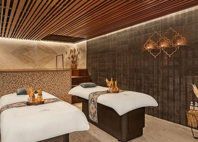 Relaxing massage room at Naturelife Spa Rixos Premium JBR, Dubai, UAE, AE with elegant decor and soft lighting.