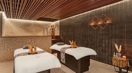 Relaxing massage room at Naturelife Spa Rixos Premium JBR, Dubai, UAE, AE with elegant decor and soft lighting.