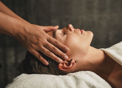 Relaxing head massage at Naturelife Spa Rixos Premium JBR, Dubai, UAE, AE, promoting wellness and peace.