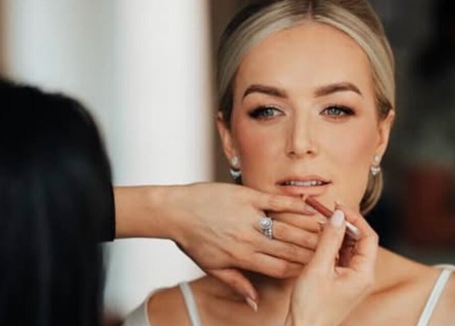 Makeup application at Rachael Hunter Makeup, East Kilbride, Scotland, GB. Lip enhancement in progress.