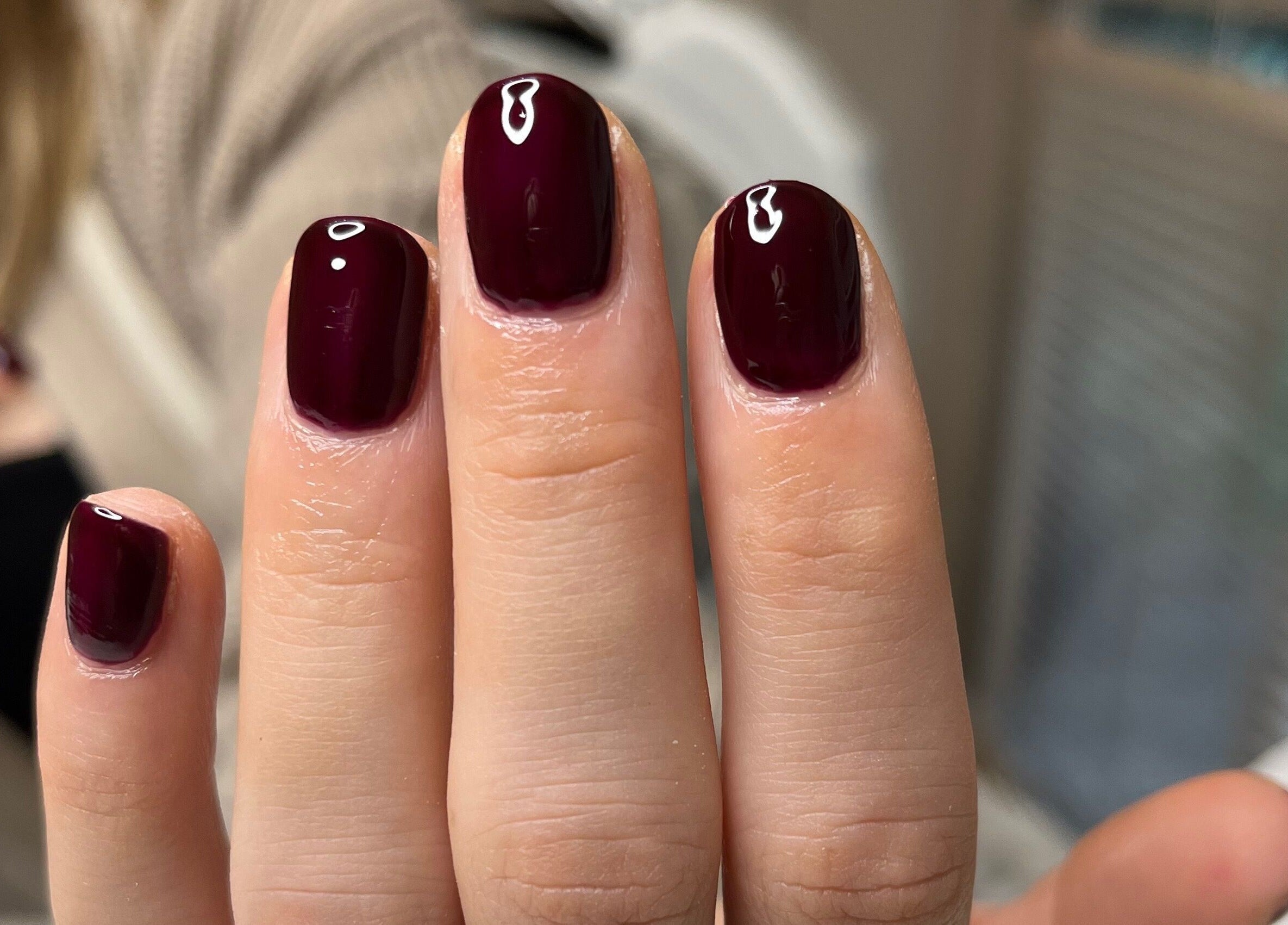 Burgundy manicure at BC Beauty & Aesthetics, Kings Langley, England, GB. Glossy finish exemplifies luxury.