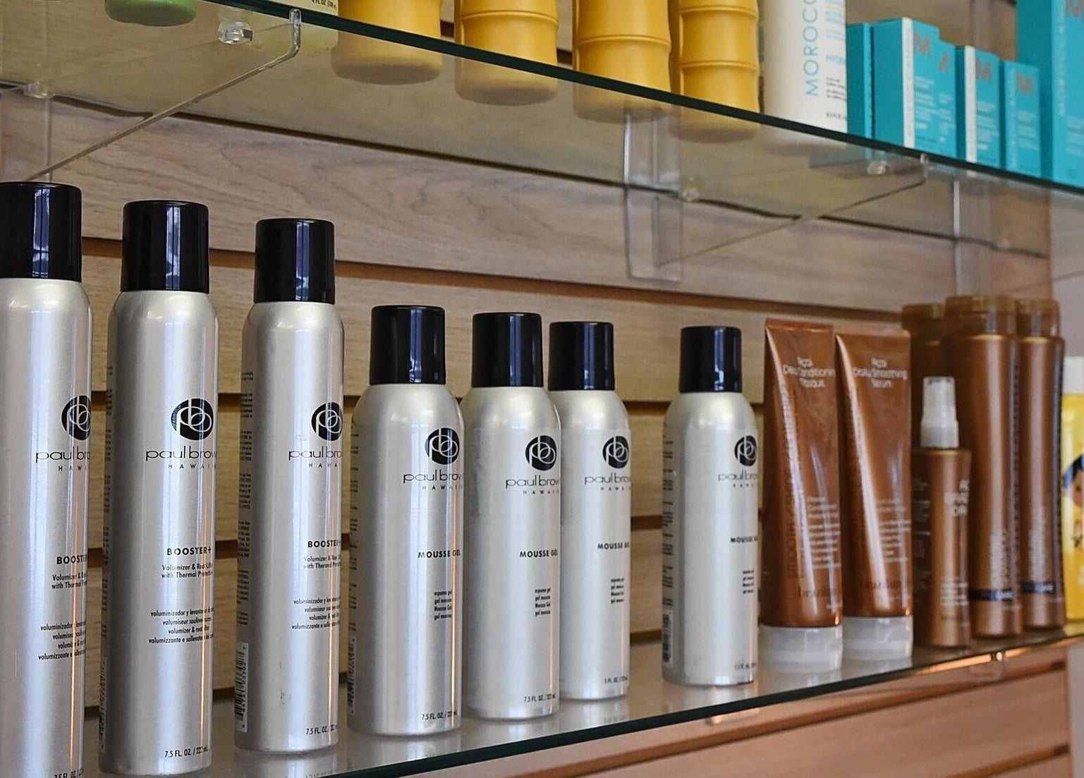 Beauty products displayed at A.L. Studios, Madison, Wisconsin, US attractively arranged on a wooden shelf.