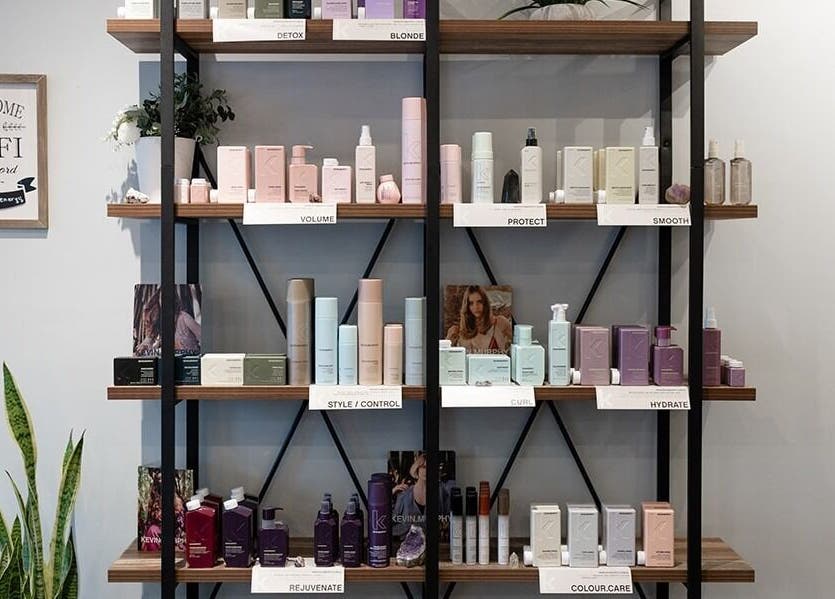 Product display at Expressions Hair Studio in Reading, Massachusetts, US, showcasing premium haircare items.