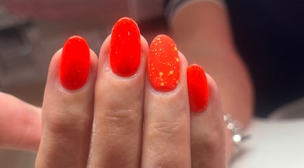 Bright red nail art at Boxmoor Beauty Room, Hemel Hempstead, England, GB showcasing vibrant style.