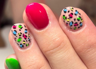 Colorful nail art design on nails at Boxmoor Beauty Room, Hemel Hempstead, England, GB.