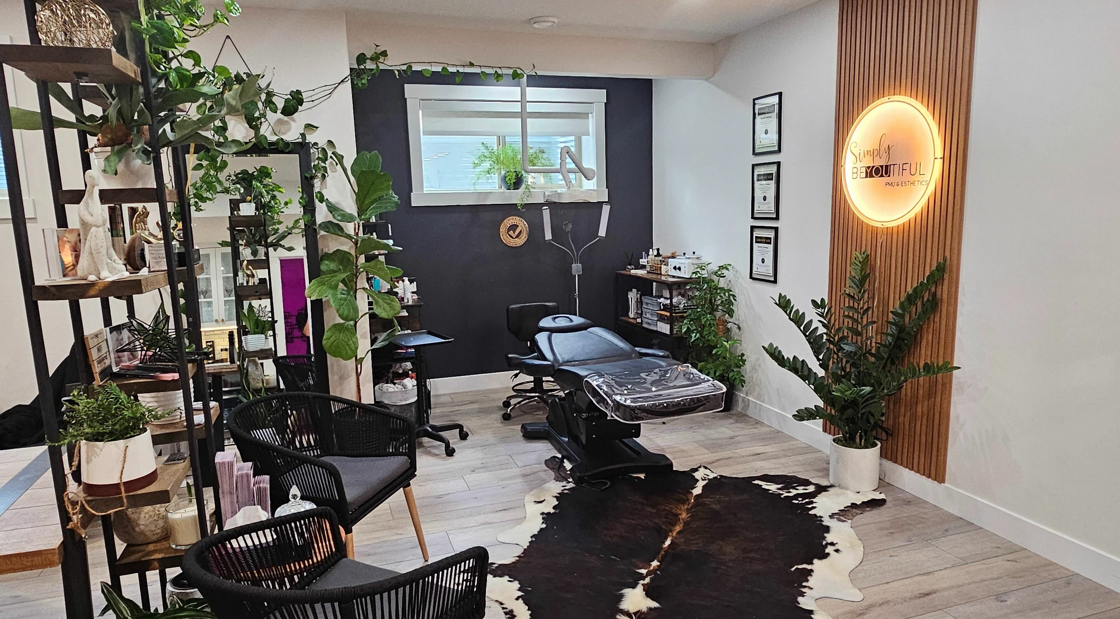 Modern interior with lush plants at Simply BeYoutiful PMU, St. Albert, Alberta, CA.