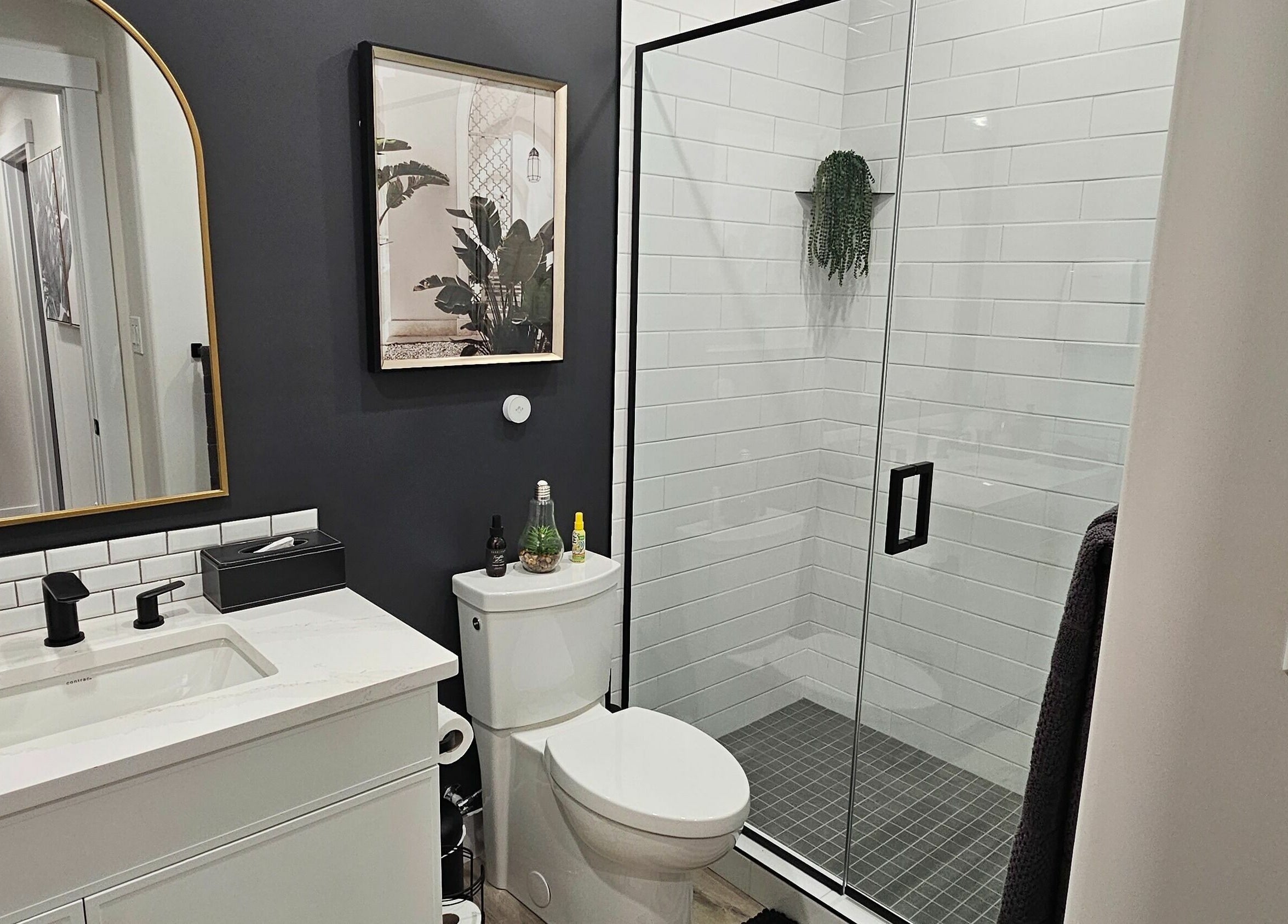 Modern bathroom at Simply BeYoutiful PMU, St. Albert, Alberta, CA with stylish decor and glass shower.