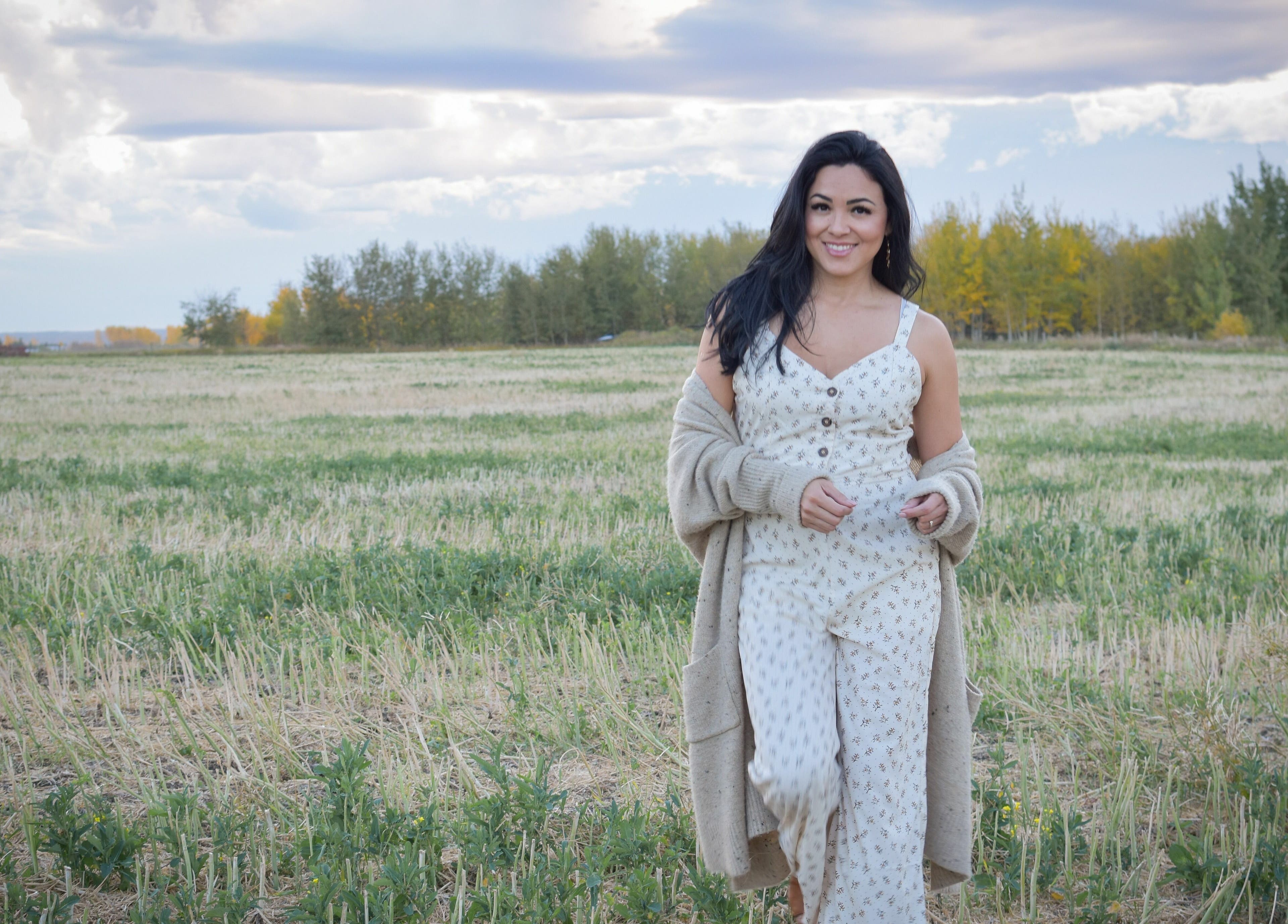 Smiling woman in a field near Simply BeYoutiful PMU, St. Albert, Alberta, CA