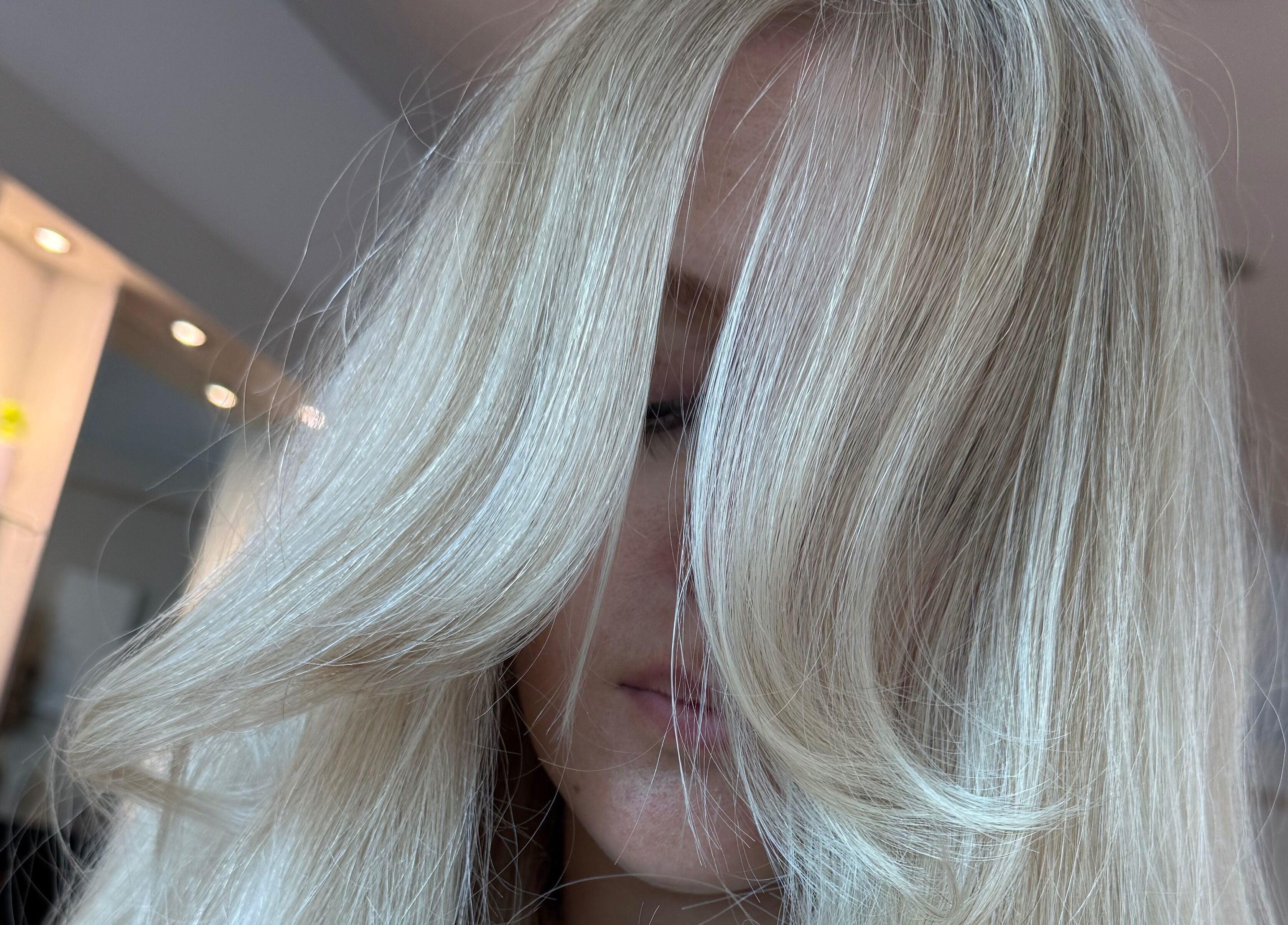 Blonde hair transformation at Ashleigh Hubbard Hair, Peterborough, England, GB showcasing silky smooth style.