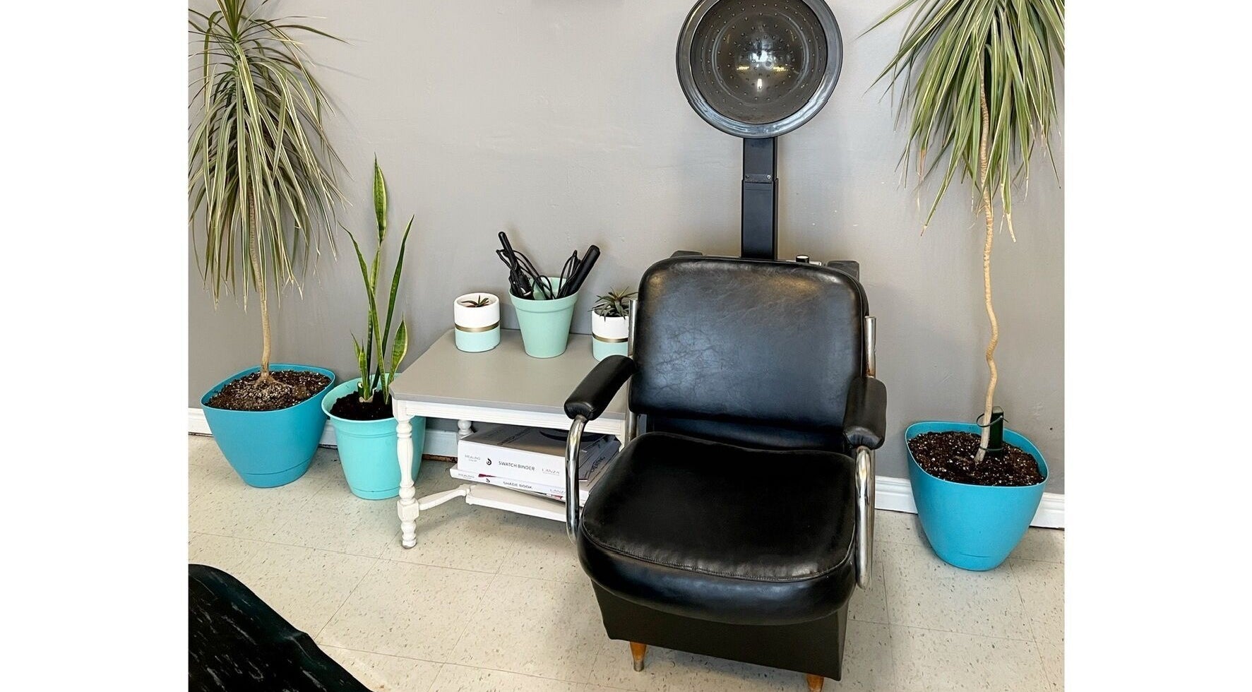 Comfy salon chair with plants at Hair Tracks, Oshawa, Ontario, CA.