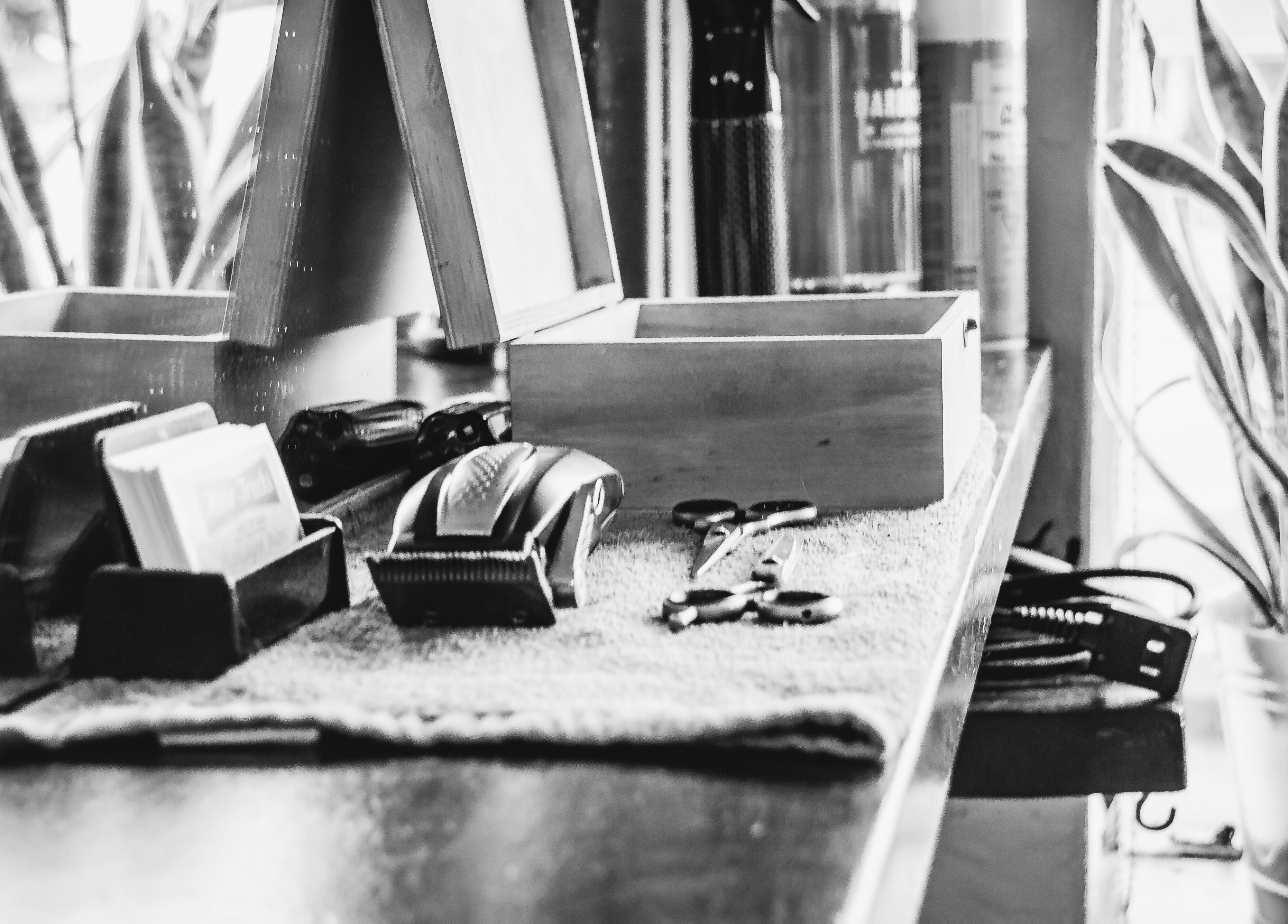 Hair Tracks salon tools and workspace in Oshawa, Ontario, CA, showcasing scissors and clippers.