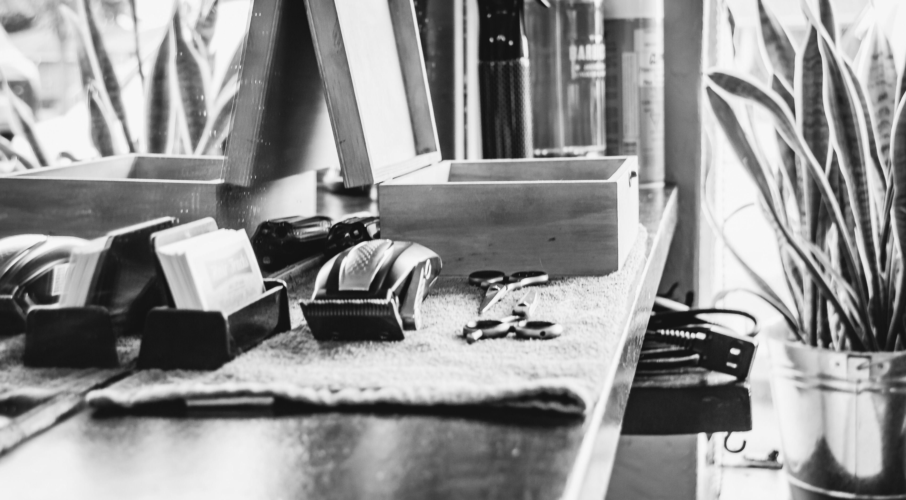 Hair Tracks salon tools and workspace in Oshawa, Ontario, CA, showcasing scissors and clippers.
