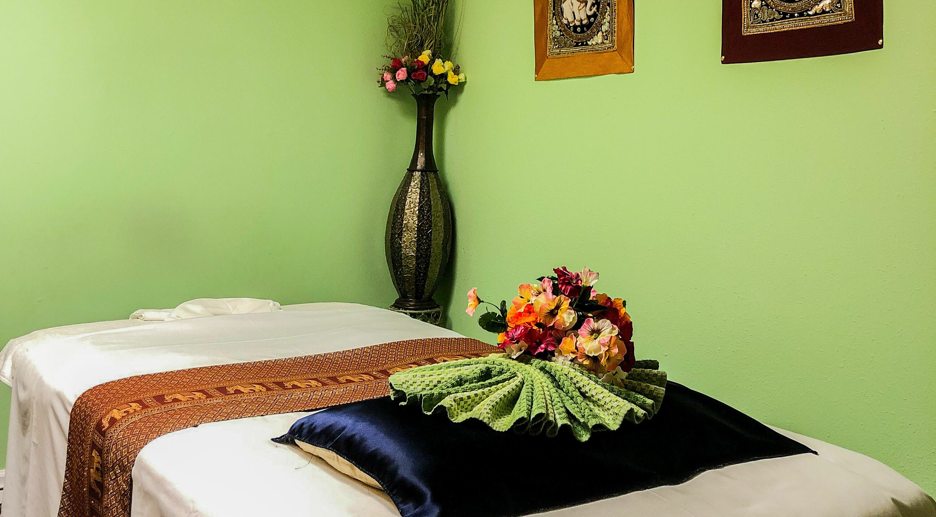 Calm massage room with fresh flowers at Jamjuree Massage, Clovis, California, US.