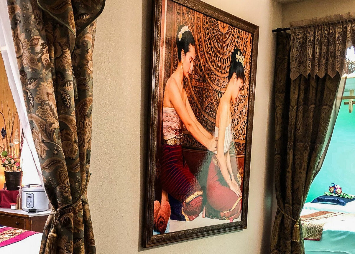 Tranquil massage room at Jamjuree Massage in Clovis, California, US featuring traditional decor and soothing ambiance.