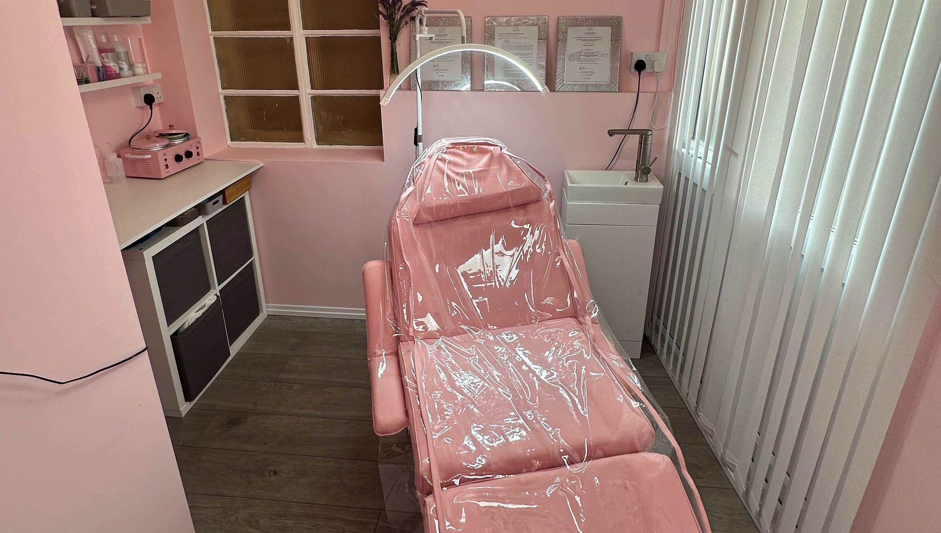 Cozy pink treatment room at Club Beauté, Lee-on-the-solent, England, GB offering tranquil wellness experience.