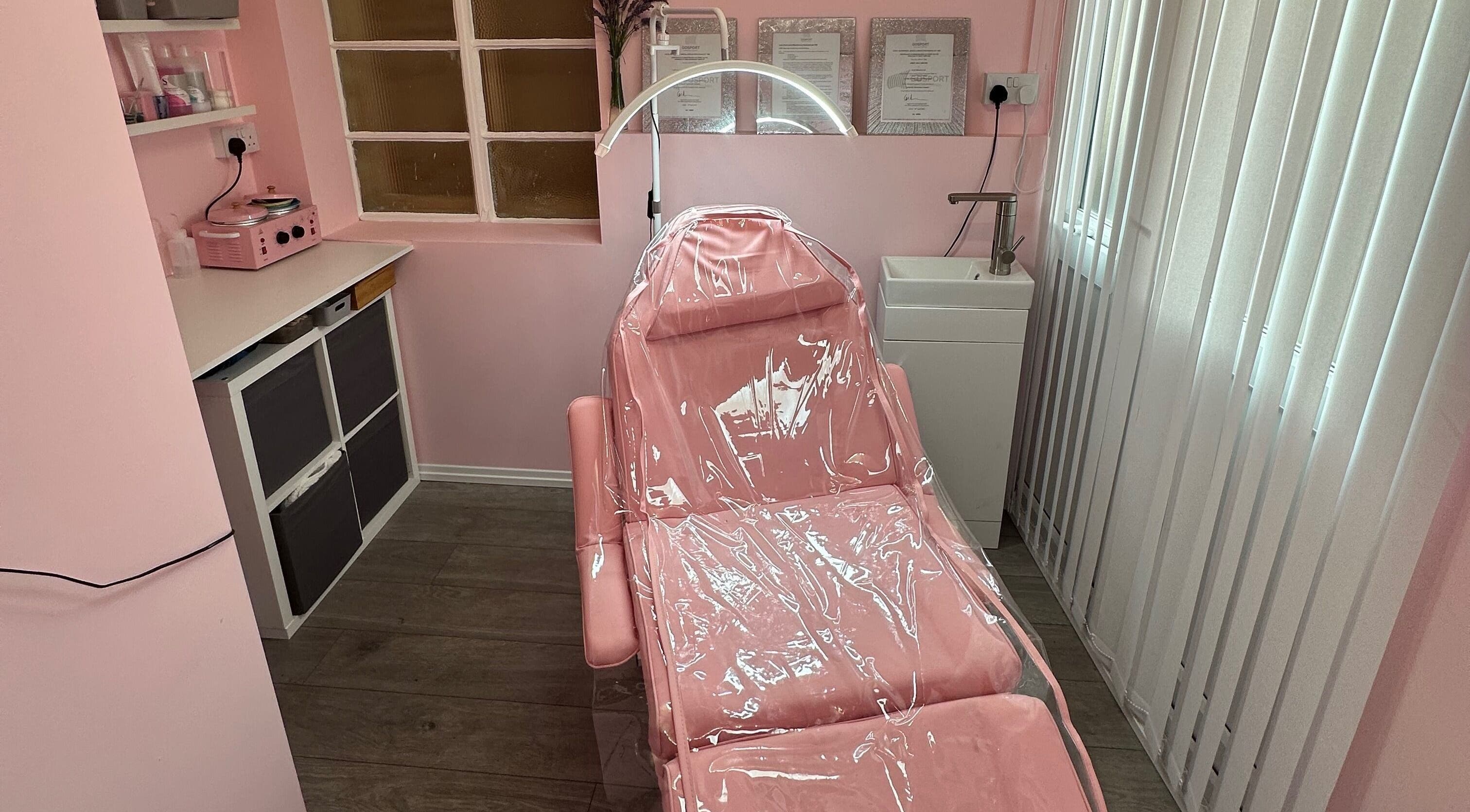 Cozy pink treatment room at Club Beauté, Lee-on-the-solent, England, GB offering tranquil wellness experience.