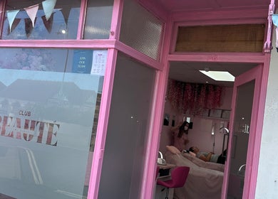Club Beauté's vibrant pink entrance at Lee-on-the-solent, England, GB with cozy interior vibe.
