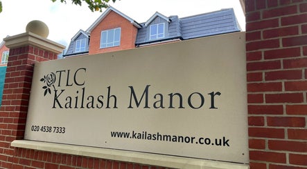 Karismha Health & Beauty Salon sign in Pinner, England, GB on a brick wall with building background.