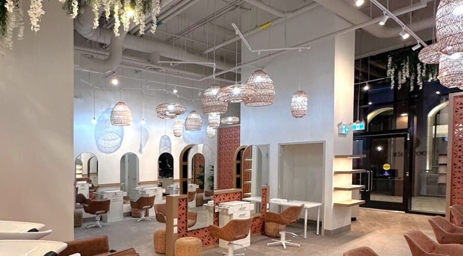 Chic interior of Odjibik Hair Repair in Toronto, Ontario, CA showcasing stylish seating and modern decor.