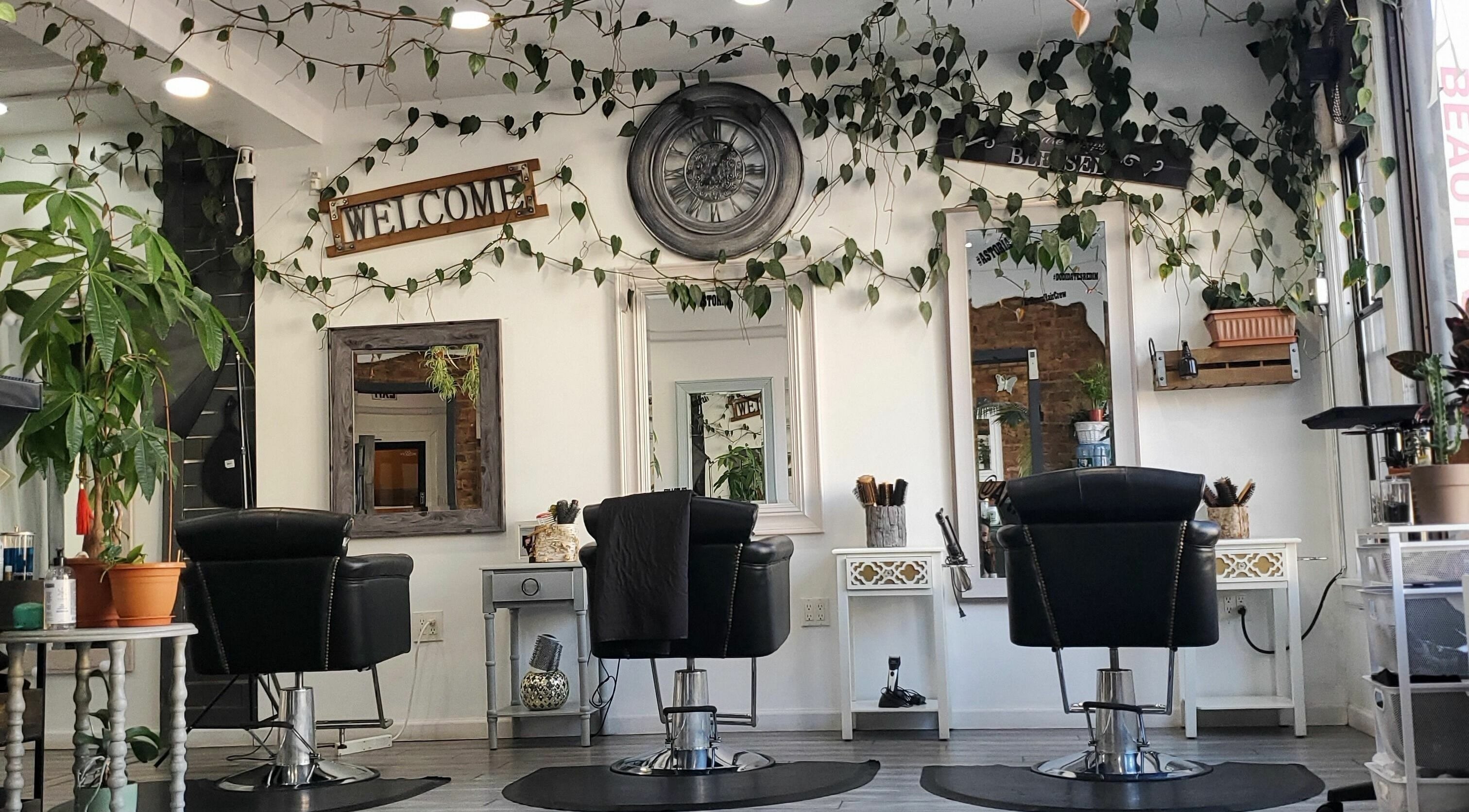 Art Room Hair Spa's stylish salon interior with lush plants, located in New York, New York, US.