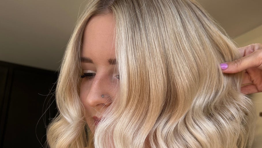 Close-up of styled blonde hair at Mirror on the Wall, Stalham, England, GB.