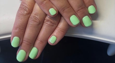 Lime green manicured nails at Mirror on the Wall, Stalham, England, GB.