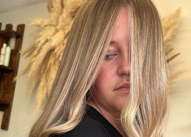 Blonde woman with sleek long hair at Mirror on the Wall, Stalham, England, GB.