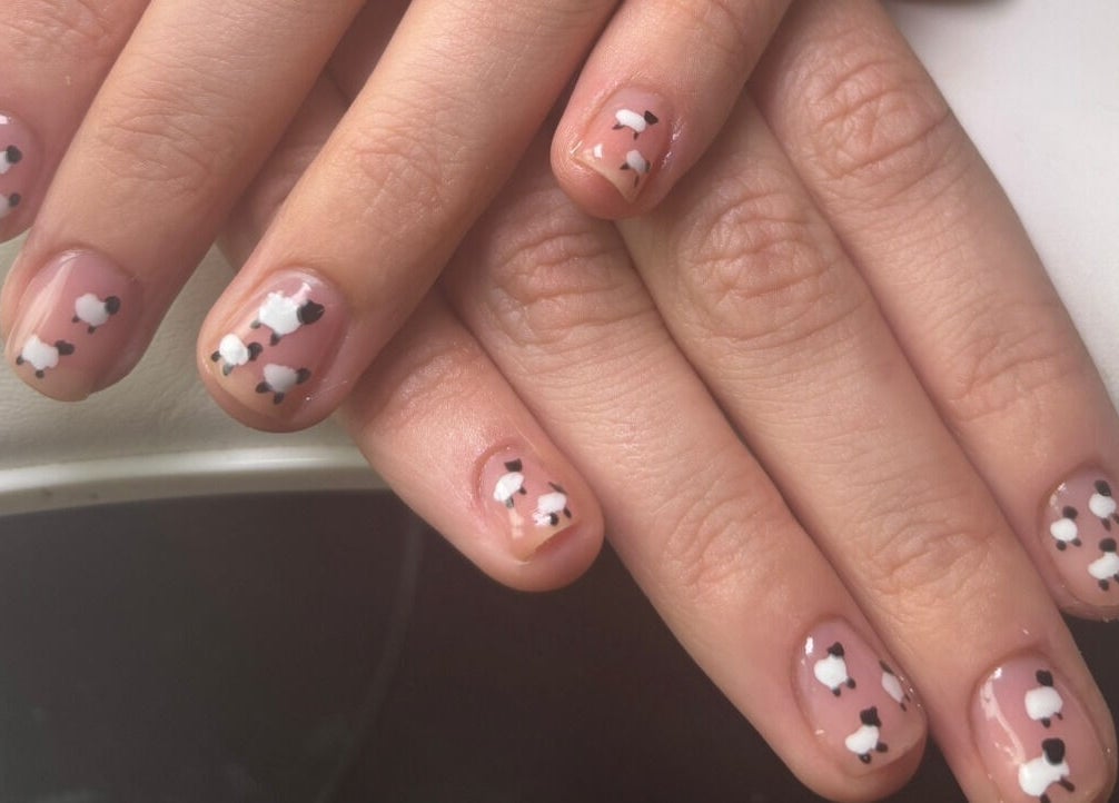 Charming sheep nail art at Mirror on the Wall, Stalham, England, GB. Perfect for fashion-forward nail designs.