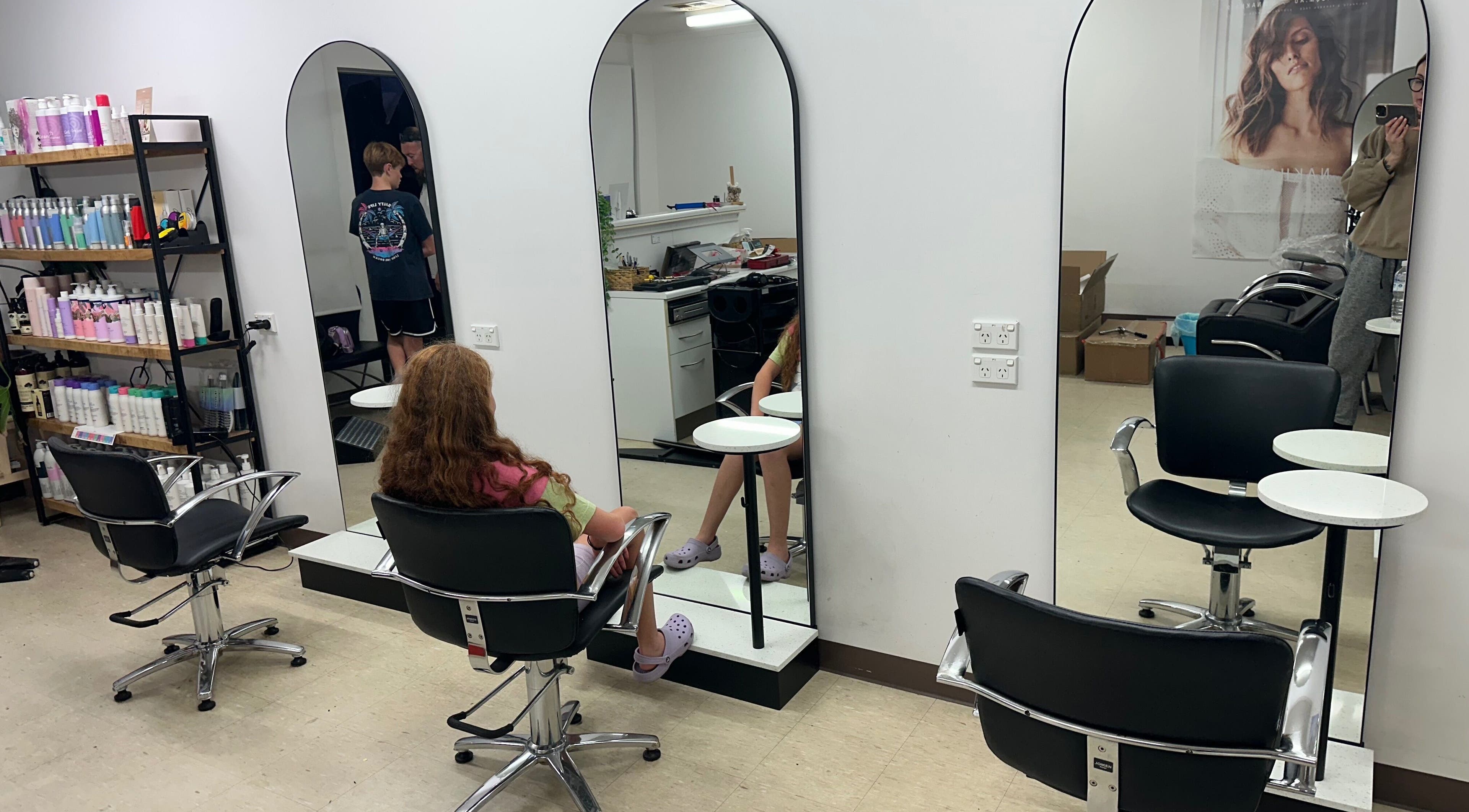 Modern salon interior at Vision Hair & Beauty, Yankalilla, South Australia, AU with stylish chairs and mirrors.